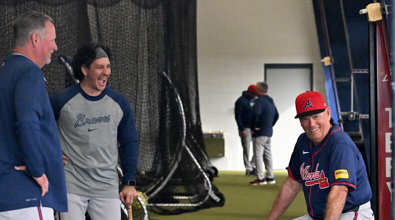 Braves manager Brian Snitker (right) shares a smile with minor-league coordinator Chris Antariksa during spring training workouts at CoolToday Park, Friday, Feb. 16, 2024, in North Port, Florida. (Hyosub Shin / Hyosub.Shin@ajc.com)