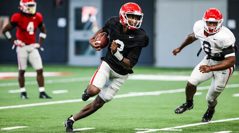 Georgia quarterback D'Wan Mathis (2) looks for running room during the Bulldogs’ practice session Monday, Sept. 21, 2020, in Athens. The Bulldogs have not announced a starter ahead of season opener at Arkansas. (Tony Walsh/UGA Sports)