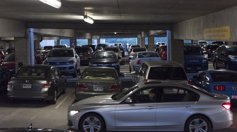 Cars fill up the parking deck at North Springs MARTA Station in Atlanta, Georgia, on Monday, April 10, 2017. Georgia Commute Option has a new, employer-focused initiative called, “Clear the Deck” where employees do not drive, even if it’s just one day, whether it’s to telework, carpool or take mass transit. The goal is to take a couple of cars off the road or in the parking deck, and to use that week to see if they can reduce parking consumption. (DAVID BARNES / DAVID.BARNES@AJC.COM)