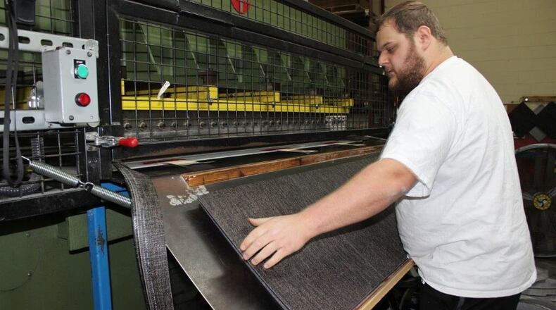 Georgia manufacturing has a long history in textiles, carpeting and other kinds of flooring. The $420 million purchase of a German-based company may not add production here, but it gives Atlanta-based Interface greater global heft. (AJC file photo)