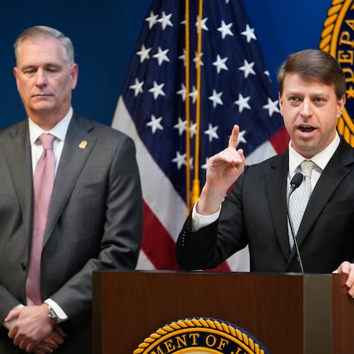 U.S. Attorney for Western District of North Carolina Russ Ferguson speaks next to FBI Special Agent James C. Barnacle, Jr. during a press conference, Friday, Jan. 2, 2026, in Charlotte, N.C. (AP Photo/Erik Verduzco)