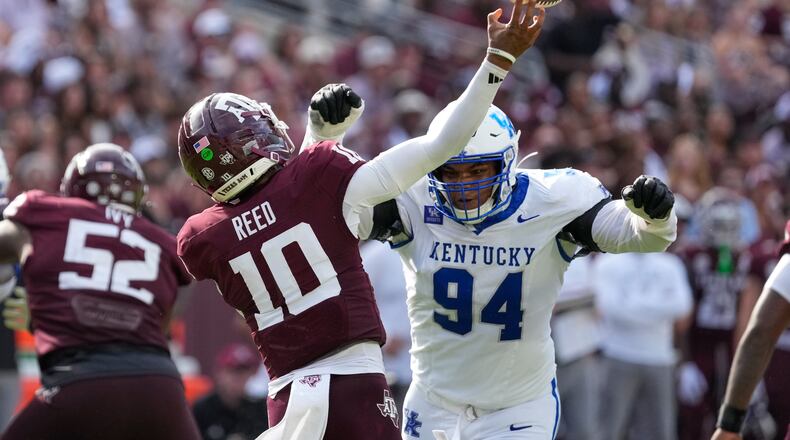 Texas A&M quarterback Marcel Reed (10) is pressured by Kentucky defensive lineman Tavion Gadson (94) during the second half of an NCAA college football game Saturday, Sept. 19, 2026, in College Station, Texas. (AP Photo/David J. Phillip)