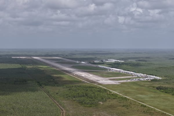 This aerial photo shows that the state is plowing ahead with building a an immigration detention facility with heavy-duty tents, trailers and other temporary buildings at the Miami Dade County-owned airfield in the Big Cypress National Preserve, about 45 miles (72 kilometers) west of downtown Miami, This Friday, June 27, 2025. (AP Photo/Daniel Kozin)