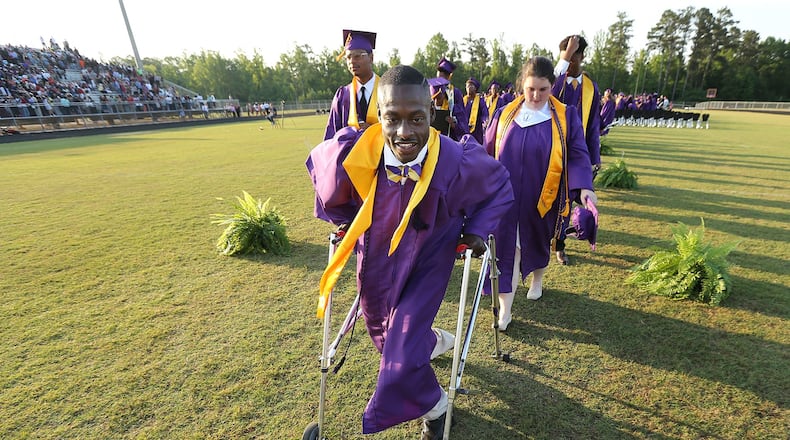 Devon Berry leads his class off the field at the conclusion of the ceremony at Hampton High School on Friday, May 27, 2016, in Hampton. Curtis Compton/ccompton@ajc.com