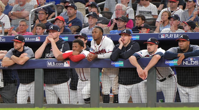 Atlanta Braves players react in the dugout during the eighth inning against the Los Angeles Dodgers in Game 4 of a National League Division Series baseball game Monday, October 8, 2018, in Atlanta. The Braves lost 6-2. Hyosub Shin/hshin@ajc.com