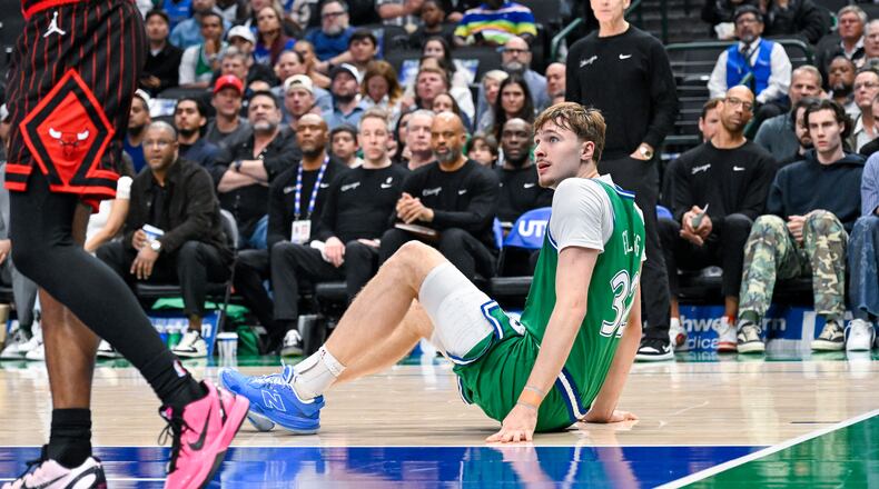 Dallas Mavericks' Cooper Flagg, right, is injured during an NBA basketball game against the Chicago Bulls, Sunday, April 12, 2026, in Dallas. (AP Photo/Albert Pena)
