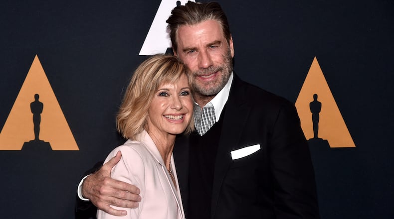 Olivia Newton-John (L) and John Travolta attend the 'Grease' 40th anniversary screening at Samuel Goldwyn Theater on August 15, 2018 in Beverly Hills, California.