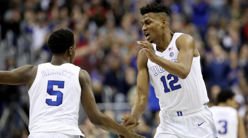 RJ Barrett Javin DeLaurier of the Duke Blue Devils celebrate a basket against the Michigan State Spartans during the second half in the East Regional game of the 2019 NCAA Men's Basketball Tournament at Capital One Arena on March 31, 2019 in Washington, DC. (Photo by Rob Carr/Getty Images)