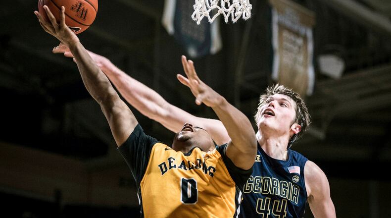 Georgia Tech center Ben Lammers (44) breaks up an attempted layup by Wake Forest guard Brandon Childress (0) in an NCAA basketball game Saturday, Feb. 4, 2017, in Winston-Salem, N.C. (Allison Lee Isley/The Winston-Salem Journal via AP)