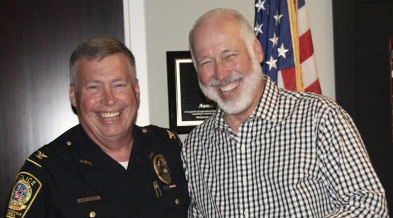Lawrenceville Police Chief Randy Johnson (left, pictured with brother and former Norcross Mayor Bucky Johnson) will retire from the department in March.
