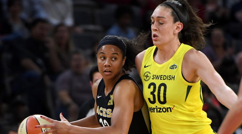Nia Coffey(#12) of the Las Vegas Aces drives against Breanna Stewart of the Seattle Storm during the Aces' inaugural regular-season home opener at the Mandalay Bay Events Center on May 27, 2018 in Las Vegas, Nevada. (Photo by Ethan Miller/Getty Images)
