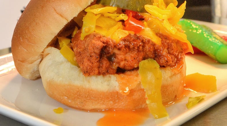 A hand-breaded free-range fried chicken sandwich is one of many specialty foods available at the new Mercedes-Benz Stadium. (Chris Hunt/Special)