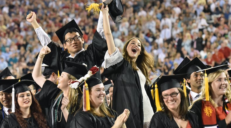 May 4, 2018 Athens - Students cheer as they move their tassels during the 2018 spring undergraduate commencement ceremony at Sanford Stadium in Athens on Friday, May 4, 2018. An estimated 7,000 students are expected to walk in the 2019 commencement ceremonies. HYOSUB SHIN / HSHIN@AJC.COM