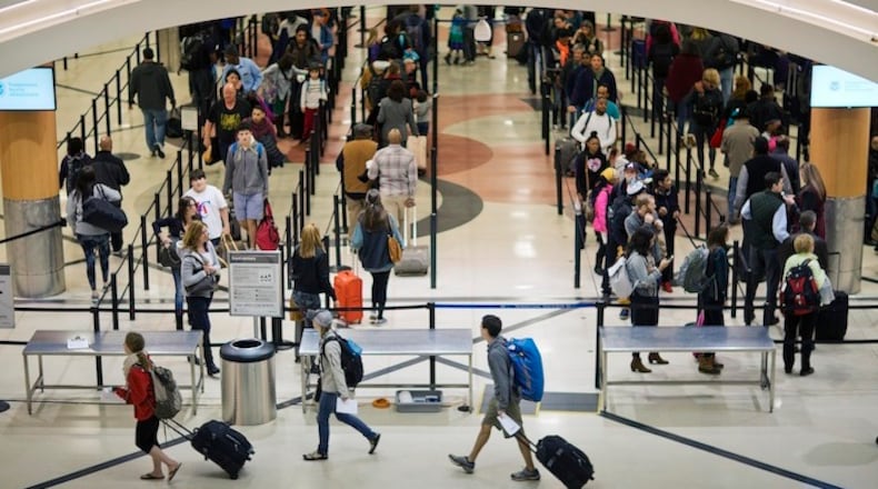 In this Nov. 25, 2015 file photo, travelers wait to go through a security checkpoint at Hartsfield–Jackson Atlanta International Airport in Atlanta. Republican leaders are lauding an aviation policy bill before the Senate as the most passenger friendly in years, but there are limits to friendship. (AP Photo/David Goldman, File)