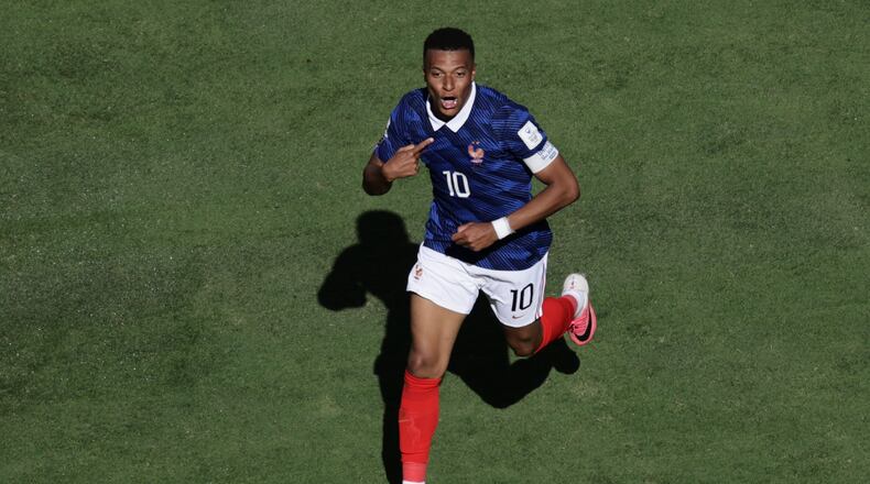 France's Kylian Mbappe celebrates after scoring thrid goal during the World Cup Group I soccer match between France and Senegal in East Rutherford, N.J., near New York, Tuesday, June 16, 2026. (AP Photo/Adam Hunger)