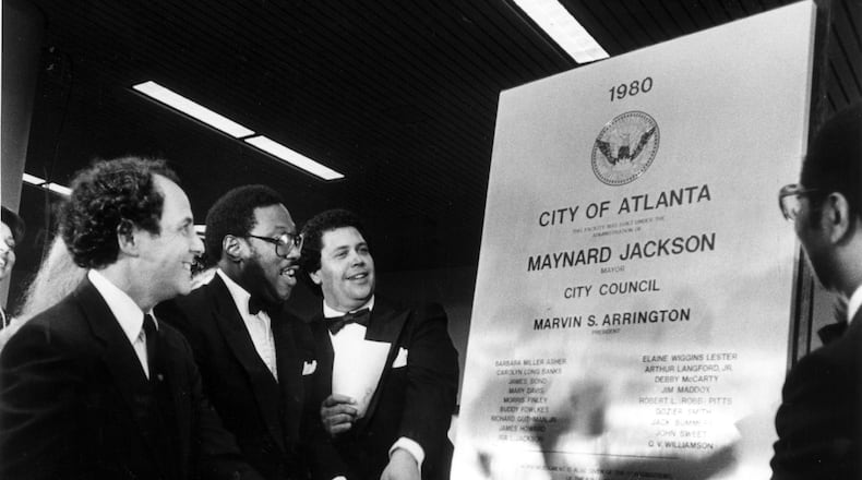 Sept. 19,1980: Former Mayor Sam Massell, Council President Marvin Arrington and Mayor Maynard Jackson unveil a plaque at the dedication of the new Atlanta Airport.