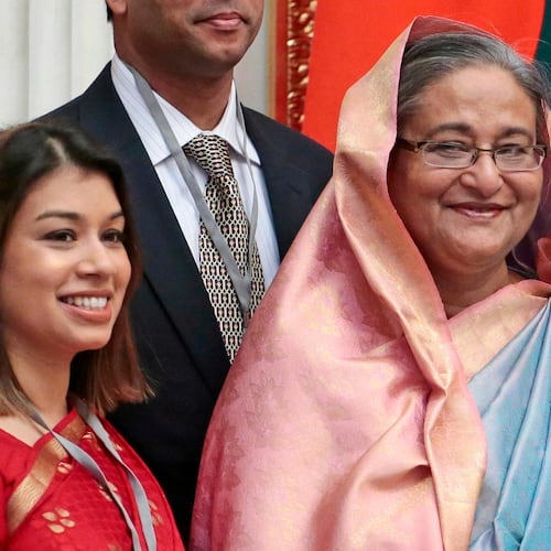FILE - Tulip Siddiq, left, stands beside Bangladesh Prime Minister Sheikh Hasina in the Kremlin in Moscow, Russia, on Jan. 15, 2013. (AP Photo/Mikhail Metzel, Pool, File)