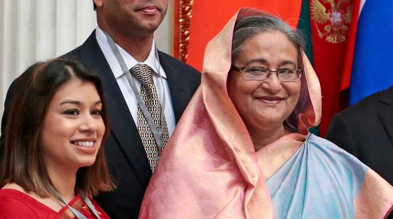 FILE - Tulip Siddiq, left, stands beside Bangladesh Prime Minister Sheikh Hasina in the Kremlin in Moscow, Russia, on Jan. 15, 2013. (AP Photo/Mikhail Metzel, Pool, File)
