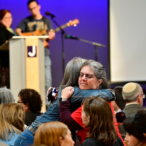 Women embrace before a community vigil at the Boulder Jewish Community Center to mark an attack on Jewish people on June 4 in Boulder, Colo. (Andy Cross/AP)