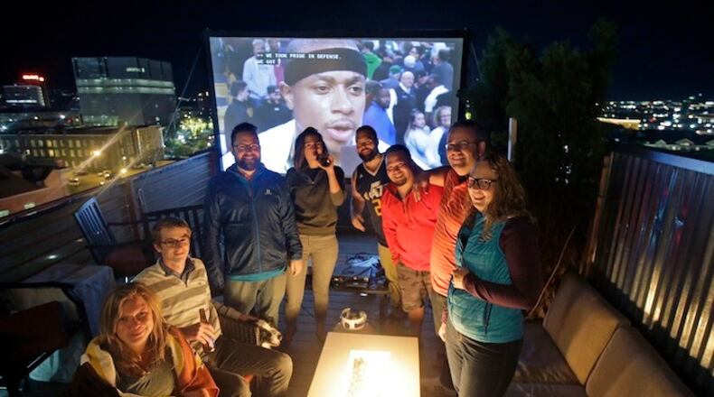 This Tuesday, May 2, 2017, photo, Utah Jazz fans party on a roof top deck during halftime during the Utah Jazz Golden State Warriors playoff game, in Salt Lake City. Salt Lake City leaders and tourism officials playfully jabbed back at Golden State Warriors players who bemoaned the lack of nightlife in Utah, hoping to combat the predominantly Mormon state's reputation as a boring place where it's tough to get a drink. The tourism agency in the state capital launched a new website and video Monday titled, "There's nothing to do in Salt Lake" that features people enjoying drinks and food at popular breweries, bars, restaurants and sporting venues. (AP Photo/Rick Bowmer)