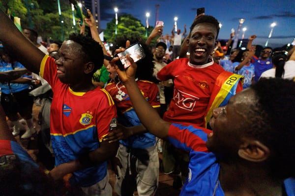 Congo fans at FIFA Fan Fest in Atlanta react to their team's weekend win over Uzbekistan. (Estela Muñoz/AJC)