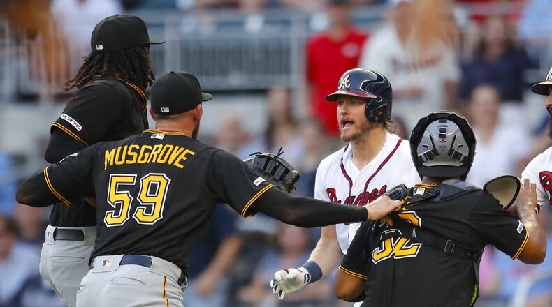 Josh Donaldson (second from right) of the Braves moves toward Pirates pitcher Joe Musgrove after being hit by a pitch in a June 10 game. (Photo by Todd Kirkland/Getty Images)
