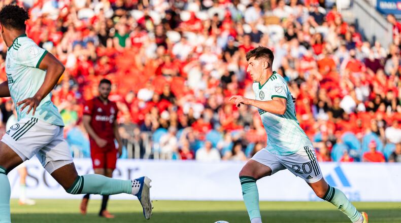 Atlanta United's Emerson Hyndman dribbles the ball during the first half of a match against Toronto FC on Saturday at BMO Field. (Photo by Dakota Williams/Atlanta United)