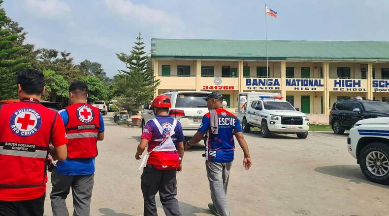 In this handout photo provided by the Philippine Red Cross, Red Cross members arrive at Banga National High School in the town of Banga, Philippines, Friday, Sept. 18, 2026. (Philippine Red Cross via AP)