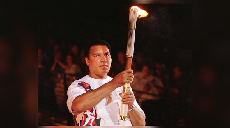 Muhammad Ali lit the cauldron at the opening ceremonies for the 1996 Olympic Games in Atlanta. (Andy Clark / Reuters)