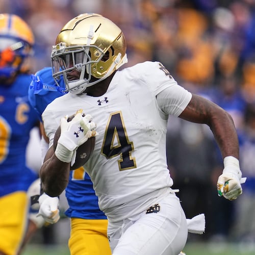 Notre Dame running back Jeremiyah Love (4) gets past Pittsburgh linebacker Kyle Louis (9) en route to a 65-yard touchdown run during the first half of an NCAA college football game in Pittsburgh, Saturday, Nov. 15, 2025. (AP Photo/Gene J. Puskar)
