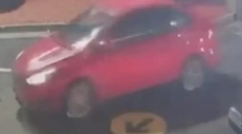 East Point police are looking for help identifying a red sedan that was allegedly involved in a fatal drive-by shooting Friday at a McDonald's on Virginia Avenue.