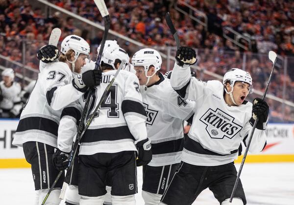 Los Angeles Kings' Trevor Moore, right, celebrates a goal against the Edmonton Oilers with teammates during the first period of an NHL hockey playoff game in Edmonton, Alberta, Sunday, April 27, 2025. (Jason Franson/The Canadian Press via AP)