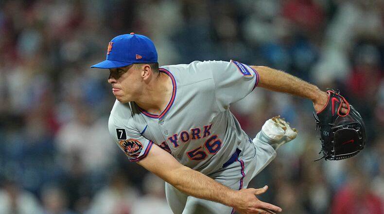 FILE - New York Mets pitcher Ryan Helsley throws during the eighth inning of a baseball game Sept. 10, 2025, in Philadelphia. (AP Photo/Matt Rourke, File)