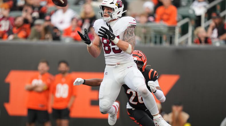 FILE - Arizona Cardinals tight end Trey McBride (85) catches a touchdown pass in the end zone during the second half of an NFL football game against the Cincinnati Bengals, Dec. 28, 2025, in Cincinnati. (AP Photo/Joshua A. Bickel, File)