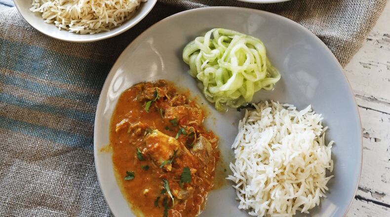 Urvashi Pitre of Keller, Texas makes her famous butter chicken with rice and cucumbers in an Instant Pot on Wednesday, January 31, 2018. She runs a blog called Two Sleevers, which features Indian food in the Instant Pot that fits the Keto diet. (David Woo/Dallas Morning News/TNS) NO MAGAZINE SALES MANDATORY CREDIT; NO SALES; INTERNET USE BY TNS CONTRIBUTORS ONLY