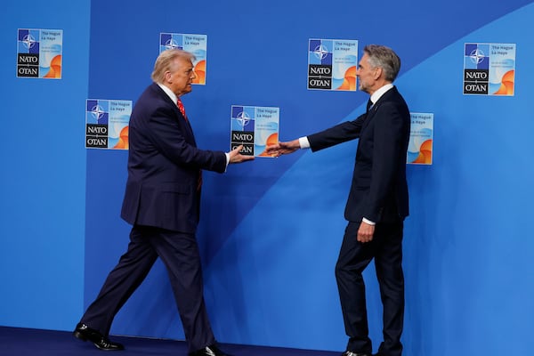 President Donald Trump is greeted by Netherland's Prime Minister Dick Schoof, right, during an official welcome at the NATO summit in The Hague, Netherlands, Wednesday, June 25, 2025. (AP Photo/Geert Vanden Wijngaert)