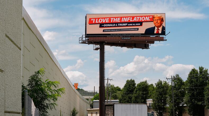 An electronic billboard that reads "I love the inflation." - Donald J. Trump June 10, 2026," is seen near I-74 in Cincinnati, Tuesday, June 16, 2026. (AP Photo/Carolyn Kaster)