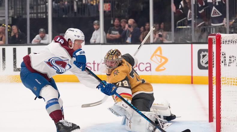 Colorado Avalanche's Jack Drury, left, scores on Vegas Golden Knights goaltender Carter Hart during the first period in Game 3 of the Western Conference finals NHL hockey Stanley Cup playoff series, Sunday, May 24, 2026, in Las Vegas. (AP Photo/Mark J. Terrill) CORRECTION: Name corrected to Jack Drury not Cale Makar.