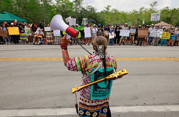 Betty Osceola with the Miccosukee tribe of Indians addresses environmental advocates and other protesters at the Dade-Collier Training and Transition Airport on Tamiami Trail E, Ochopee, Fla.,on Saturday, June 28, 2025. (Mike Stocker /South Florida Sun-Sentinel via AP)