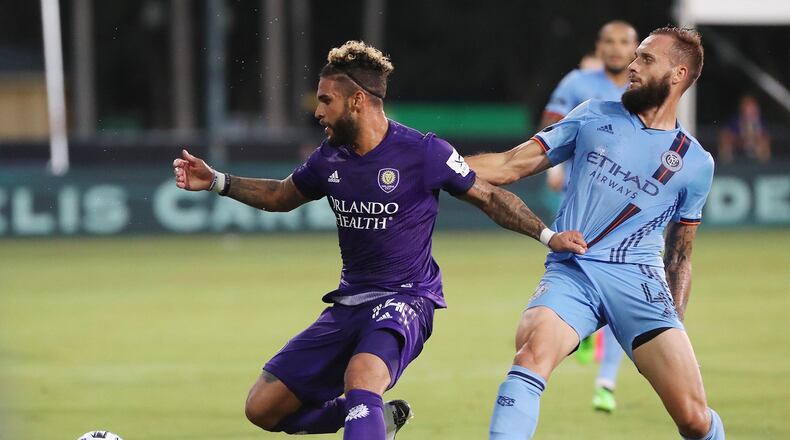 Striker Dom Dwyer (left) signed a two-year deal with Atlanta United on Tuesday. (Stephen M. Dowell/Orlando Sentinel/TNS)