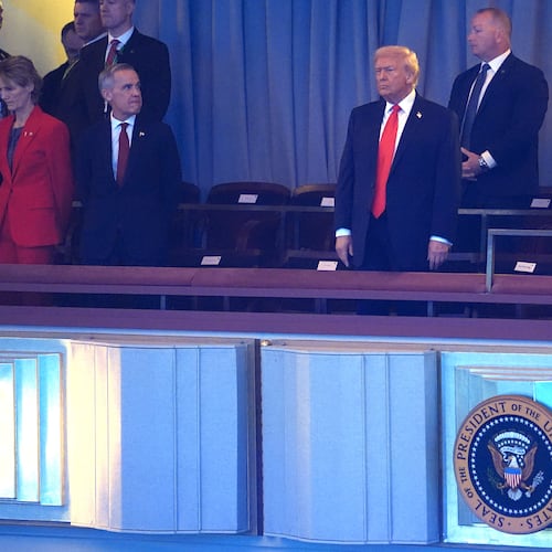 President Donald Trump stands suring his arrival at the Kennedy Center for the 2026 FIFA World Cup draw, Friday, Dec. 5, 2025, in Washington. (AP Photo/Evan Vucci)