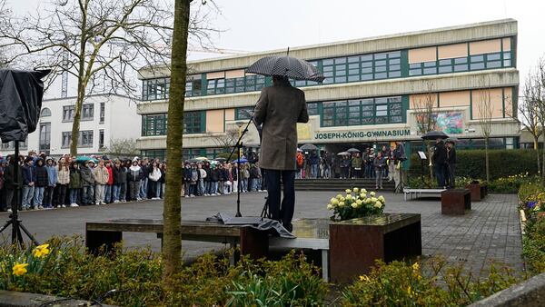 The headmaster speaks to students during a memorial ceremony in the schoolyard of the Joseph-Koenig high school in Haltern, Germany, ten years after 16 pupils and two teachers of the school died in the Germanwings crash in the French Alps, Monday, March 24, 2025. (AP Photo/Martin Meissner)