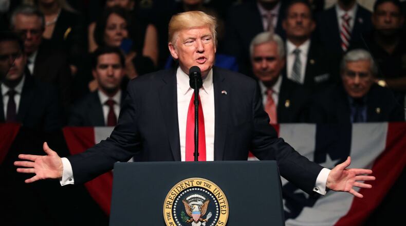 MIAMI, FL - JUNE 16: U.S. President Donald Trump speaks about policy changes he is making toward Cuba at the Manuel Artime Theater in the Little Havana neighborhood on June 16, 2017 in Miami, Florida. The President will re-institute some of the restrictions on travel to Cuba and U.S. business dealings with entities tied to the Cuban military and intelligence services. (Photo by Joe Raedle/Getty Images)