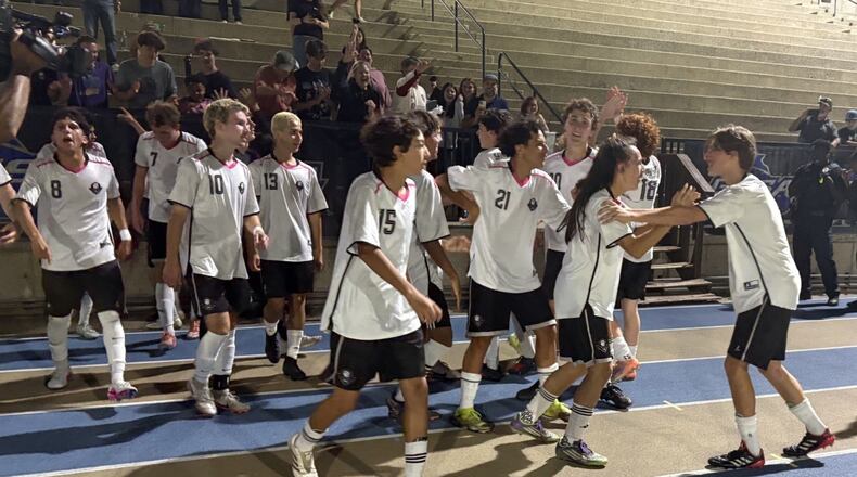 Savannah Arts Academy players celebrate after defeating Pierce County 2-0 in the Class 2A boys soccer championship game May 13, 2026, at St. Pius X High School in Atlanta. (Chip Saye/AJC)
