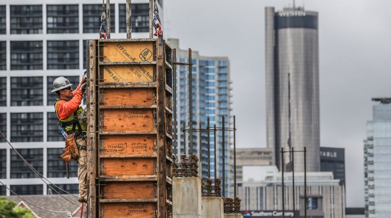 Crews work on an off-campus student housing community in Midtown in 2017. JOHN SPINK/JSPINK@AJC.COM