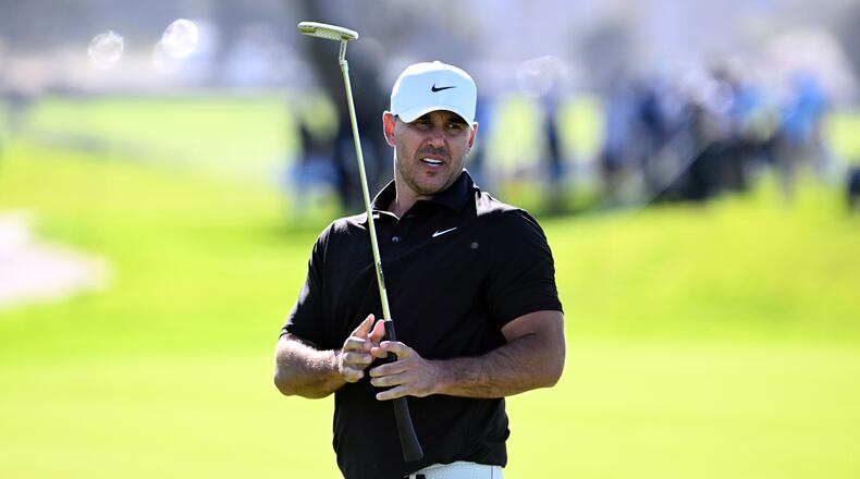 Brooks Koepka reacts after missing a birdie putt on the fourth hole on the South Course at Torrey Pines during the first round of the Farmers Insurance Open golf tournament Thursday, Jan. 29, 2026, in San Diego. (AP Photo/Denis Poroy)