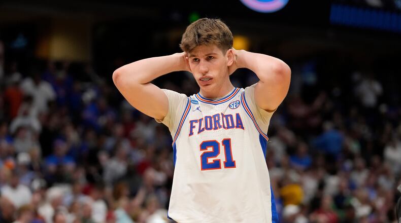 Florida forward Alex Condon (21) reacts after the team lost to Iowa during the second round of the NCAA college basketball tournament Sunday, March 22, 2026, in Tampa, Fla. (AP Photo/Chris O'Meara)