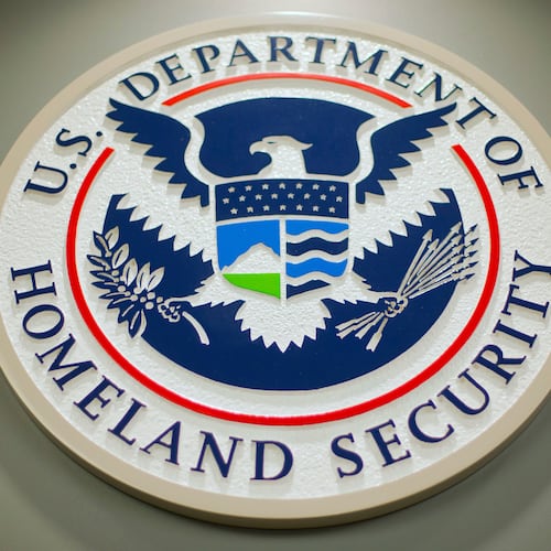 FILE - The Department of Homeland Security logo is seen during a news conference in Washington, Feb. 25, 2015. (AP Photo/Pablo Martinez Monsivais, File)
