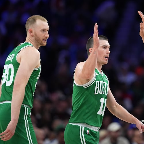 Boston Celtics' Sam Hauser, from left, Payton Pritchard and Nikola Vucevic react during the first half of Game 4 against the Philadelphia 76ers in a first-round NBA basketball playoffs series Sunday, April 26, 2026, in Philadelphia. (AP Photo/Matt Slocum)
