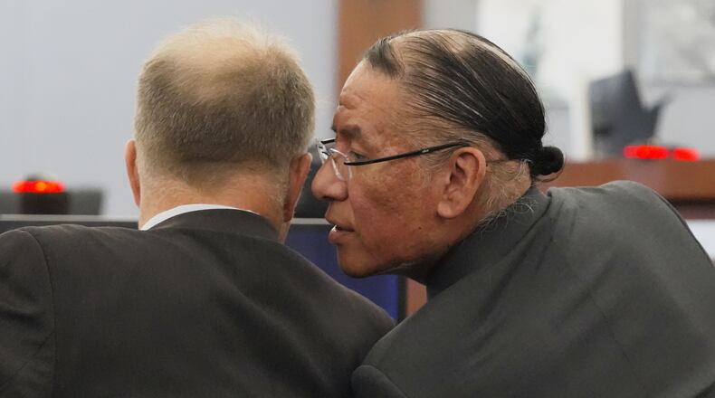 Nathan Chasing Horse, right, talks to his attorney Craig Mueller during his trial on charges of sexually abusing Indigenous women and girls Tuesday, Jan. 13, 2026, in Las Vegas. (AP Photo/Ty ONeil)